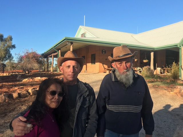 Standing with (older) people in the bush